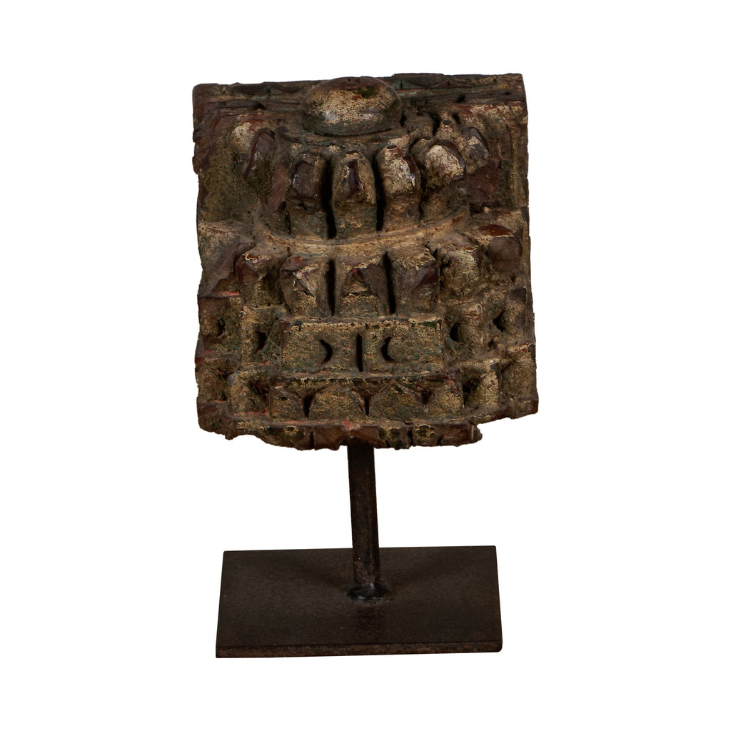 Carved Wooden Pillar Capital Fragments on Iron Stands by Studio Vastu