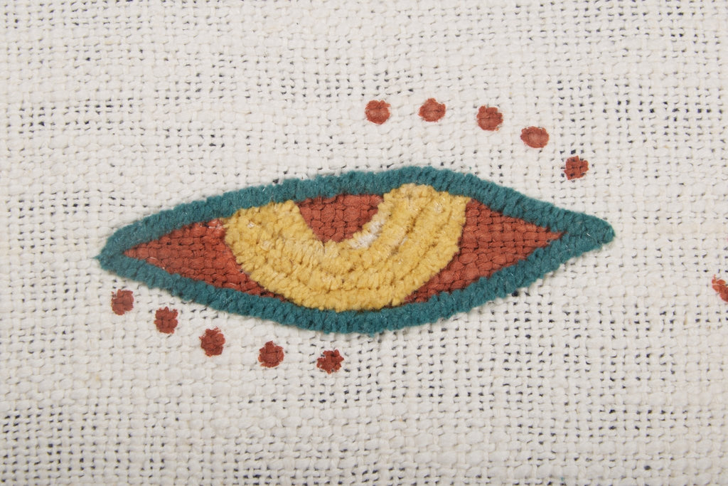 Embroidered Eye Motif Cotton Lumbar Pillow by Studio Vastu